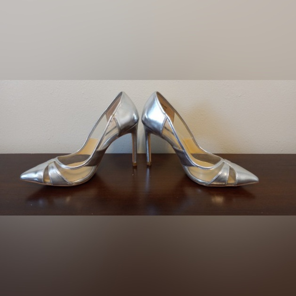 a pair of silver stilettos by zara size  6
